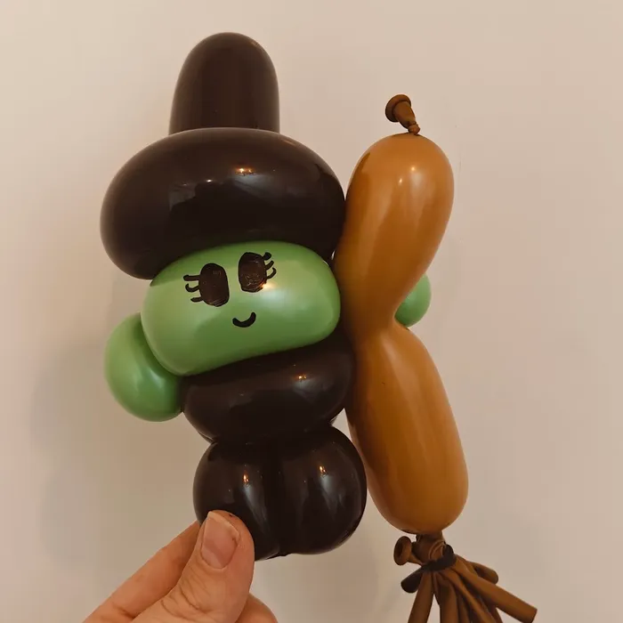 Balloon witch character with a broom